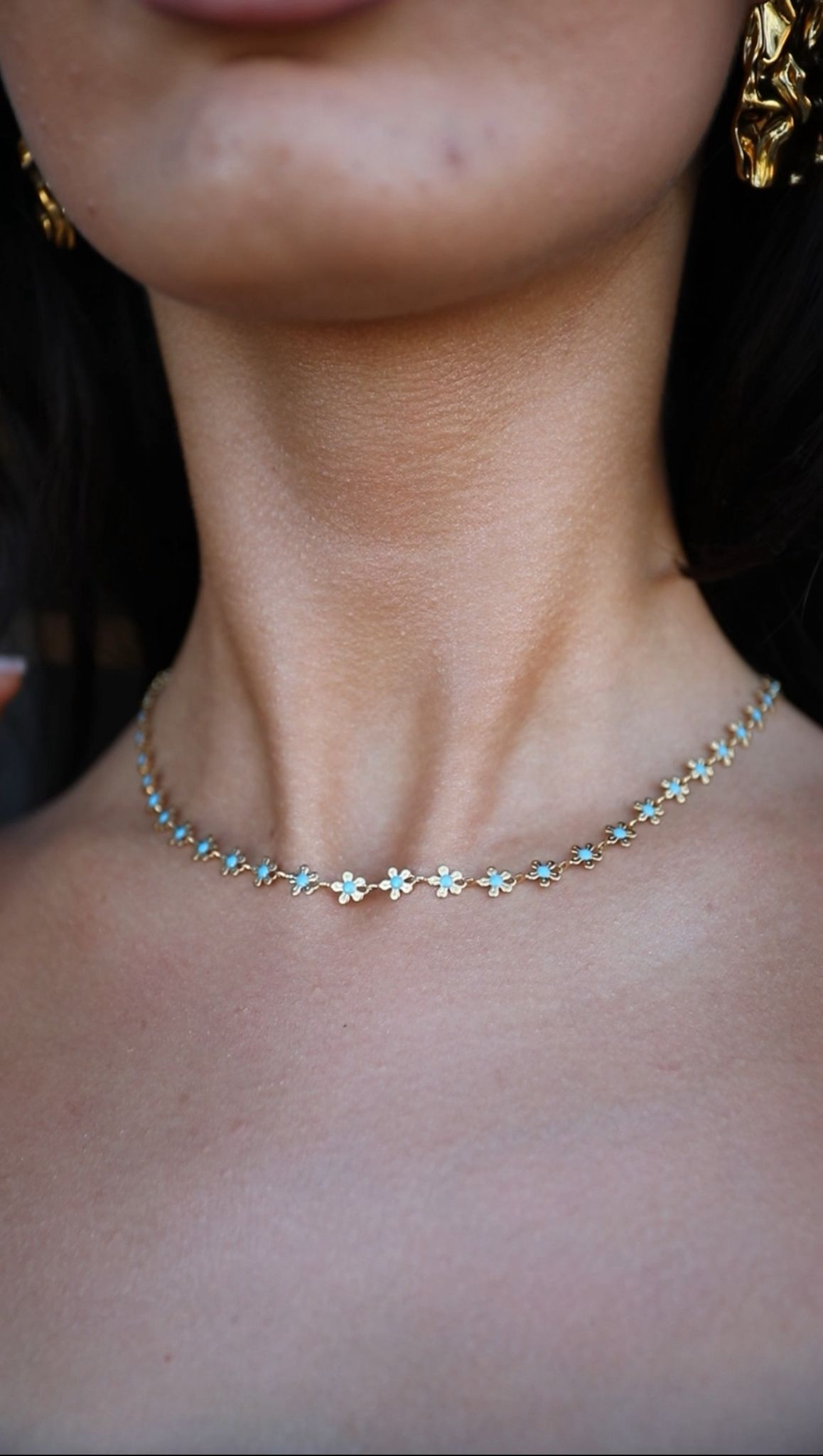 Blue flower charm necklace and bracelet set worn by woman - Free Bloom Set by Cleo Jewelry